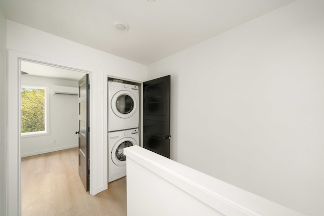 Hallway with washer and dryer